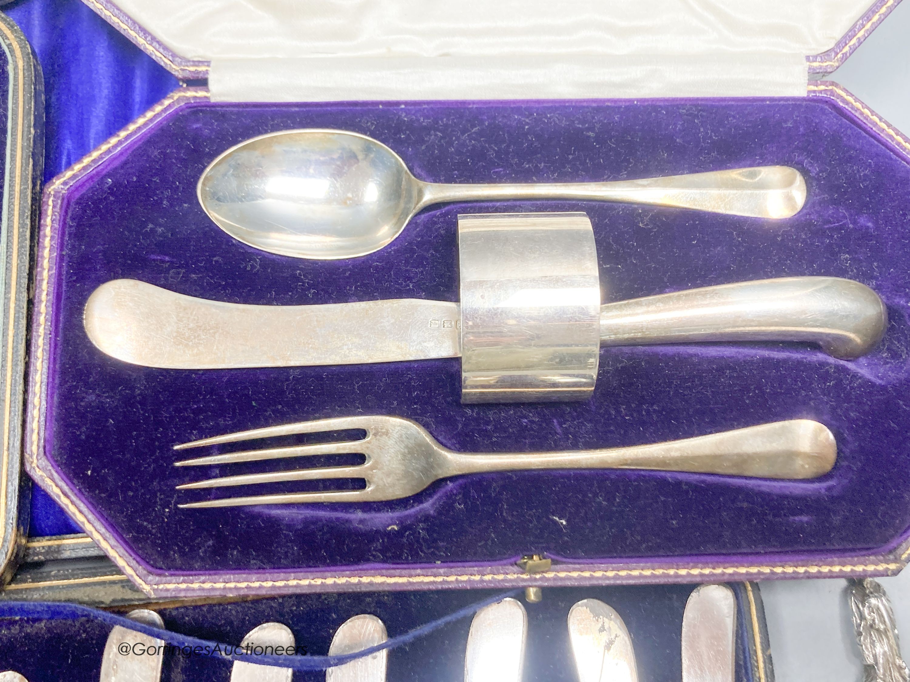A pair of late Victorian silver apostle serving spoons, William Hutton & Sons Ltd, London, 1895, 20.4cm and three cased sets, including christening set, cake knives and plated apostle spoons